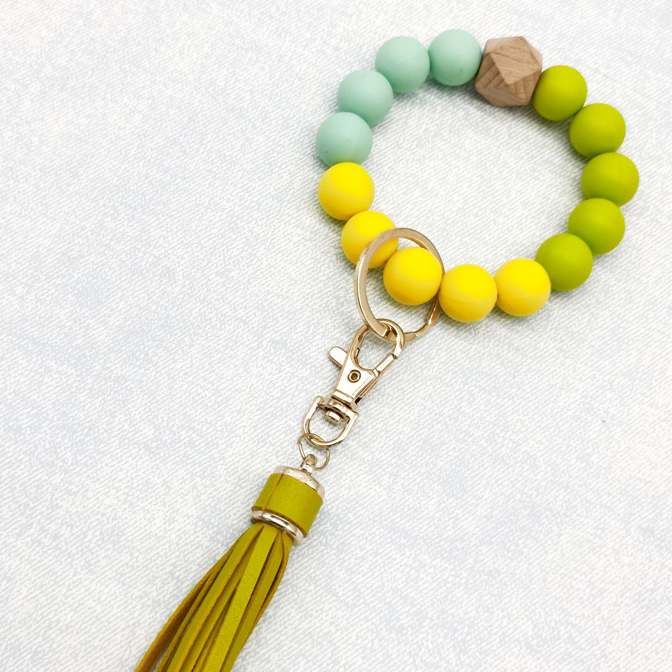 Pulsera de cuentas de silicona con borlas al por mayor llavero de muñeca